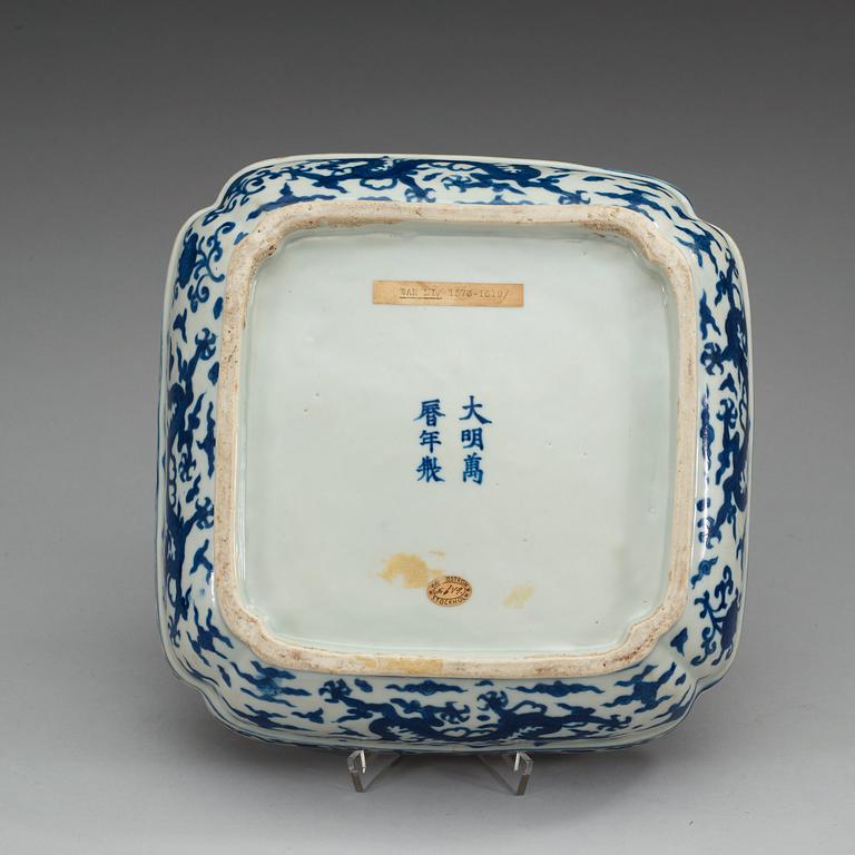 A blue and white five clawed dragon box with a wooden cover and stand, Ming dynasty with Wanli six character mark.