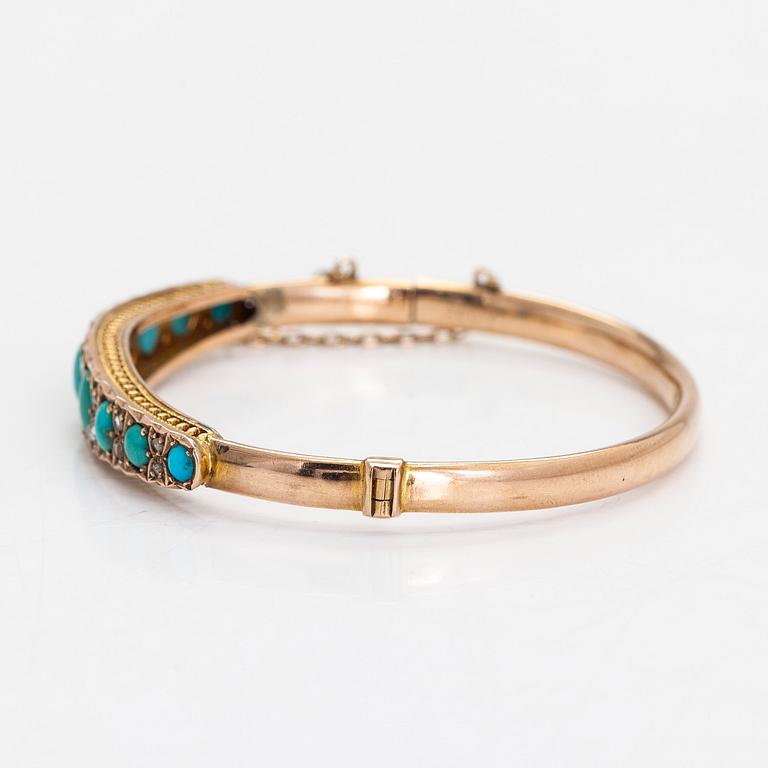 An approximately 9-11K gold bangle, with turquoises and rose-cut diamonds.