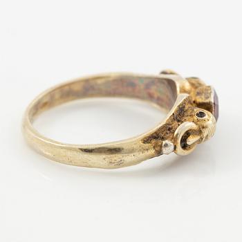 Two rings in silver with pink/red stones.