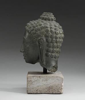 A stone head of Buddha. Thailand.