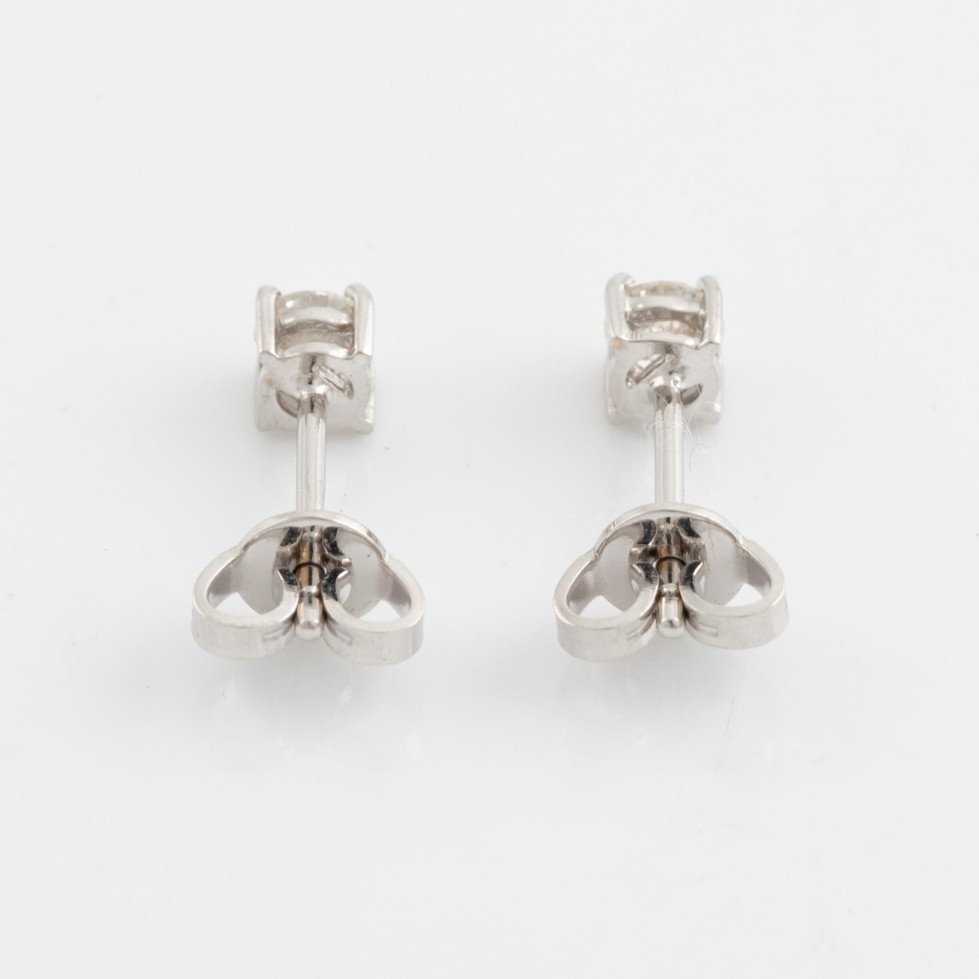 Brilliant cut diamond stud earrings.