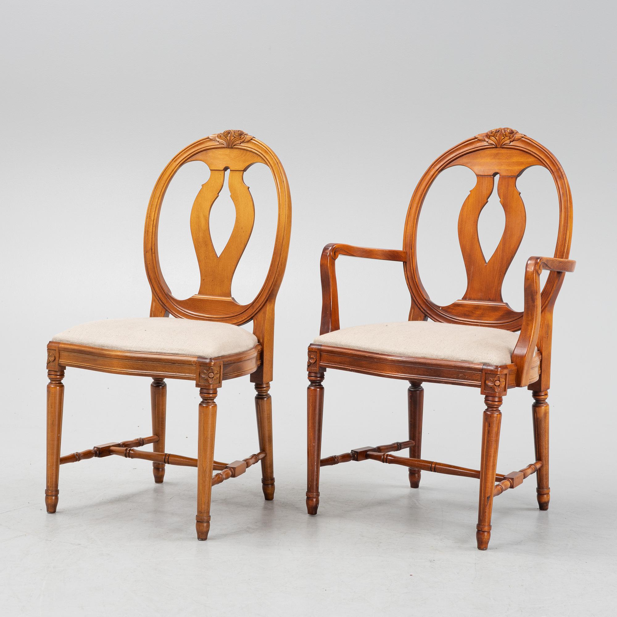 A Gustavian style dining table with two armchairs and four chairs, late 20th century.
