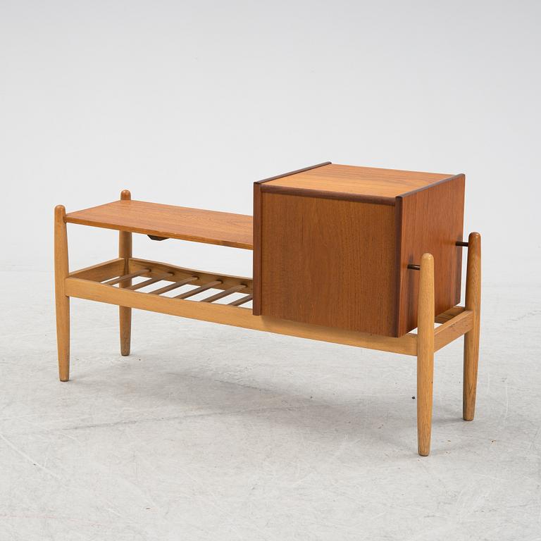 A teak chest of drawers with shelves, 1950's/60's.