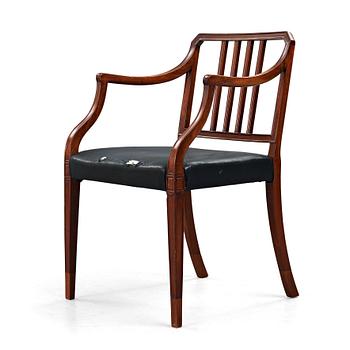 28. An English 20th century mahogany armchair.