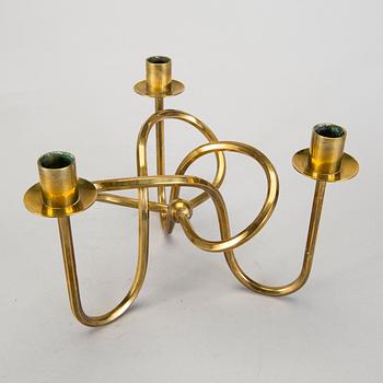 A Josef Frank brass 'Vänskapsknuten' candelabrum from Svenskt Tenn.