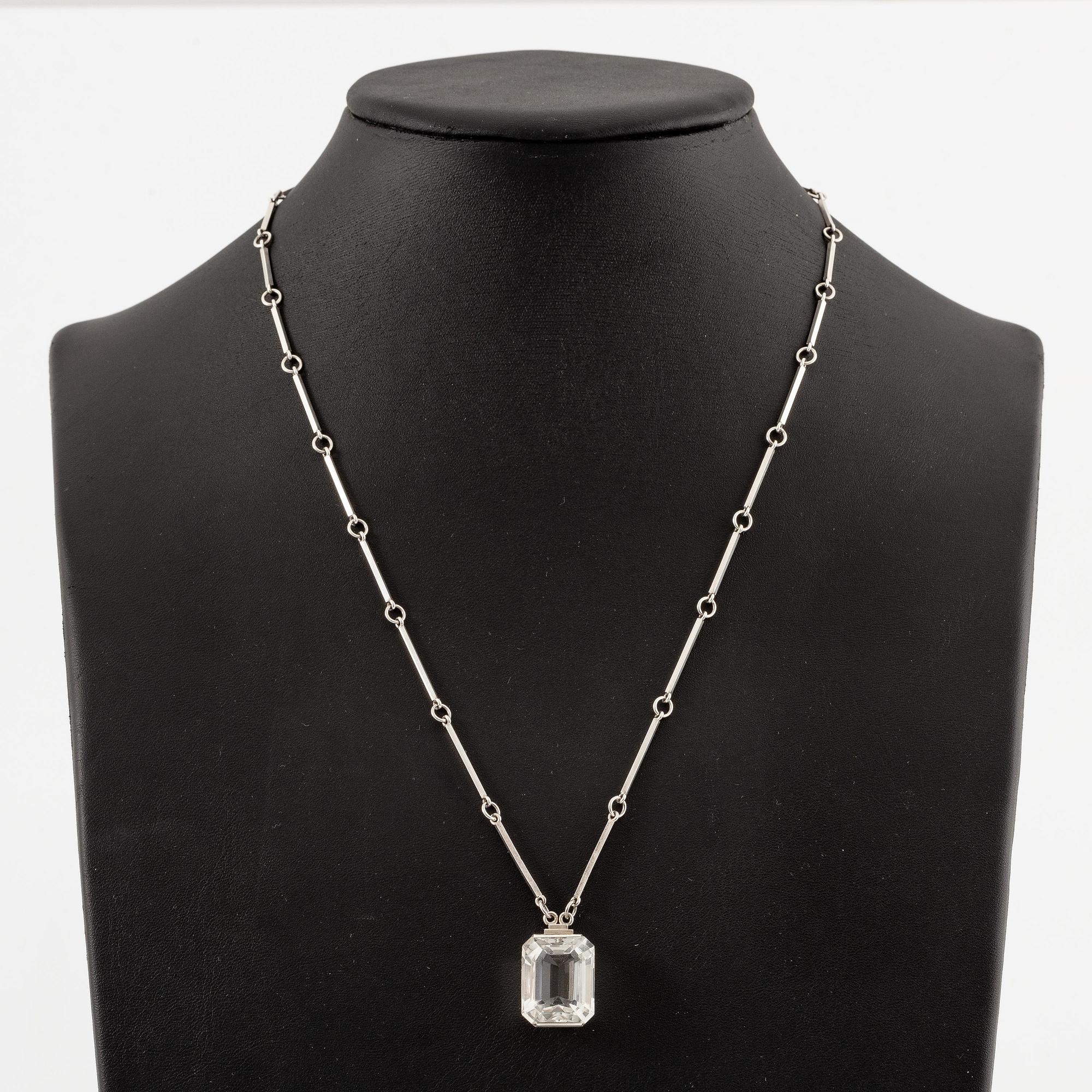 Wiwen Nilsson, a necklace, ring and pendant chain with pendant, silver with rock crystal, Lund 1947.