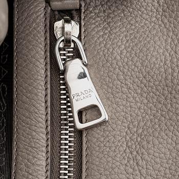 Prada, a leather handbag.