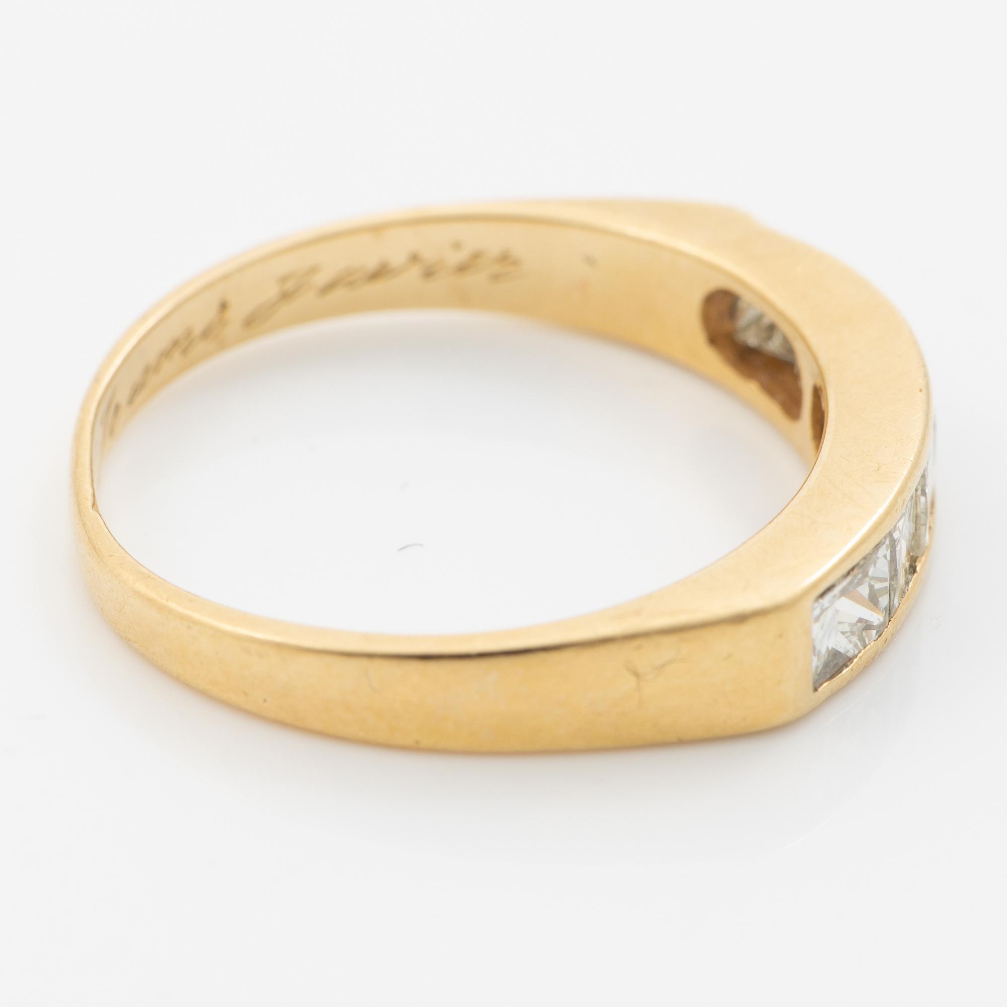 14K gold ring with princess-cut diamonds.