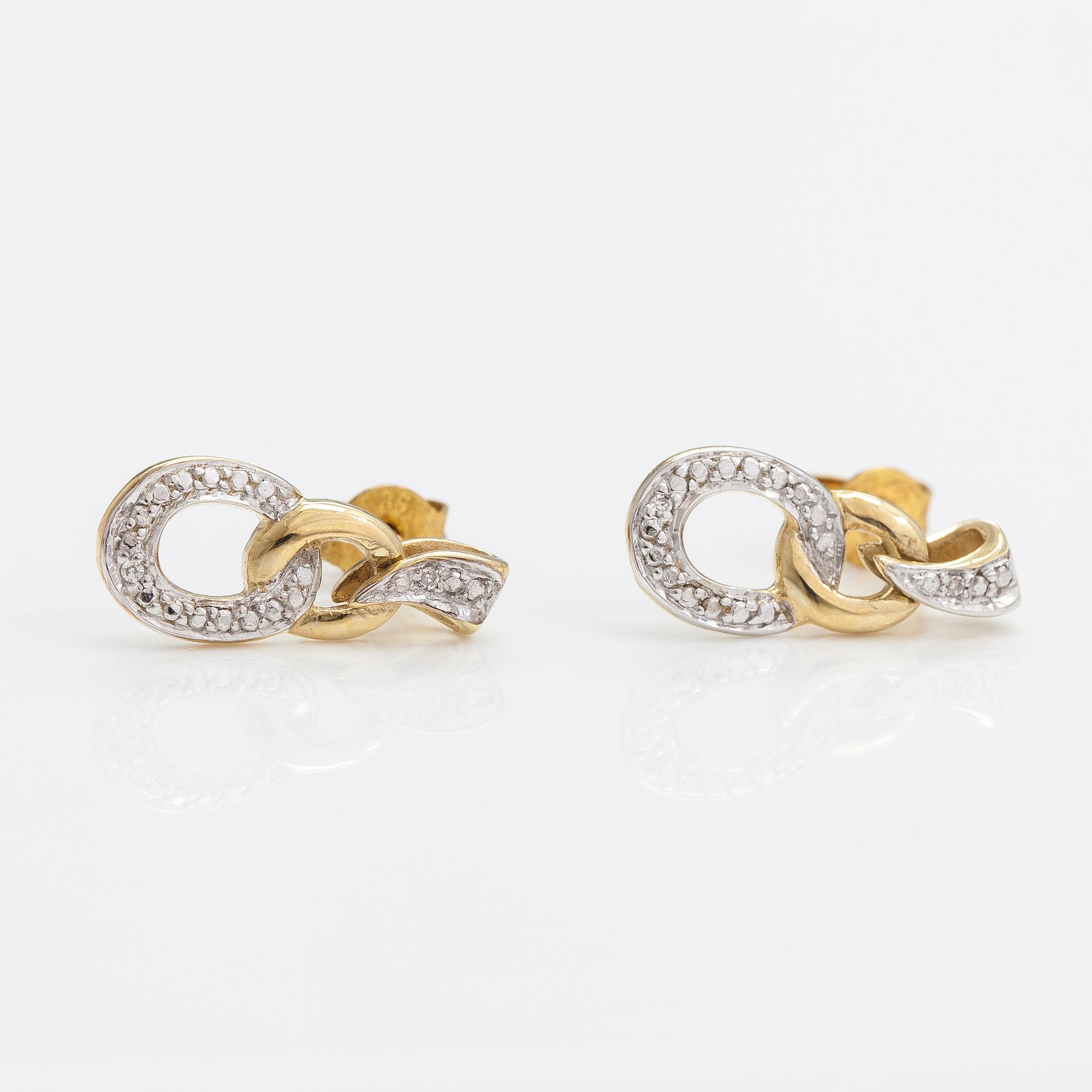 A pair of 14K gold earrings with diamonds ca. 0.01 ct in total.