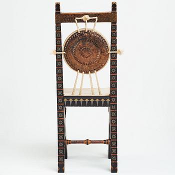 CARLO BUGATTI, an ebonized wood and walnut chair, Turin, Italy ca 1900.