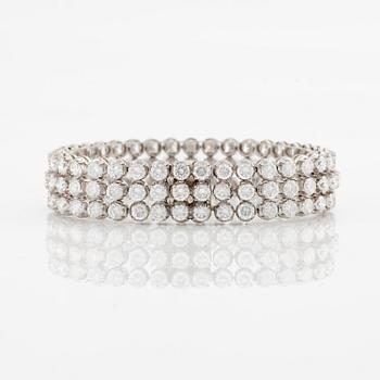 A platinum bracelet set with round brilliant-cut diamonds.