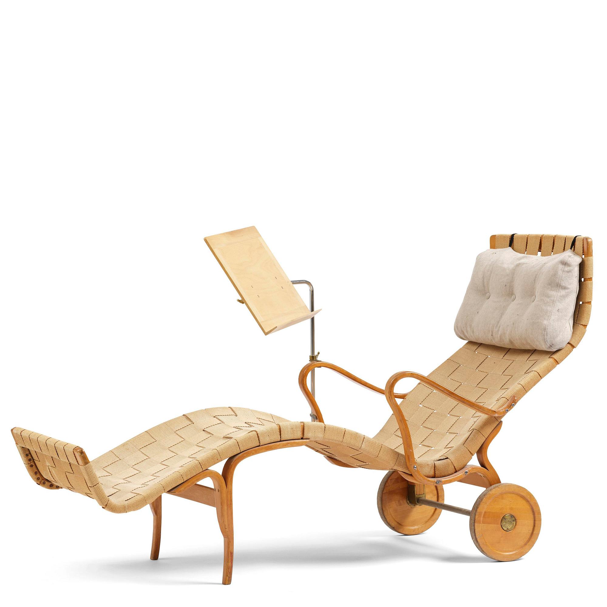 Bruno Mathsson, a lounge chair with wheels, Firma Karl Mathsson, Värnamo, 1940s, with reading table from 1972.