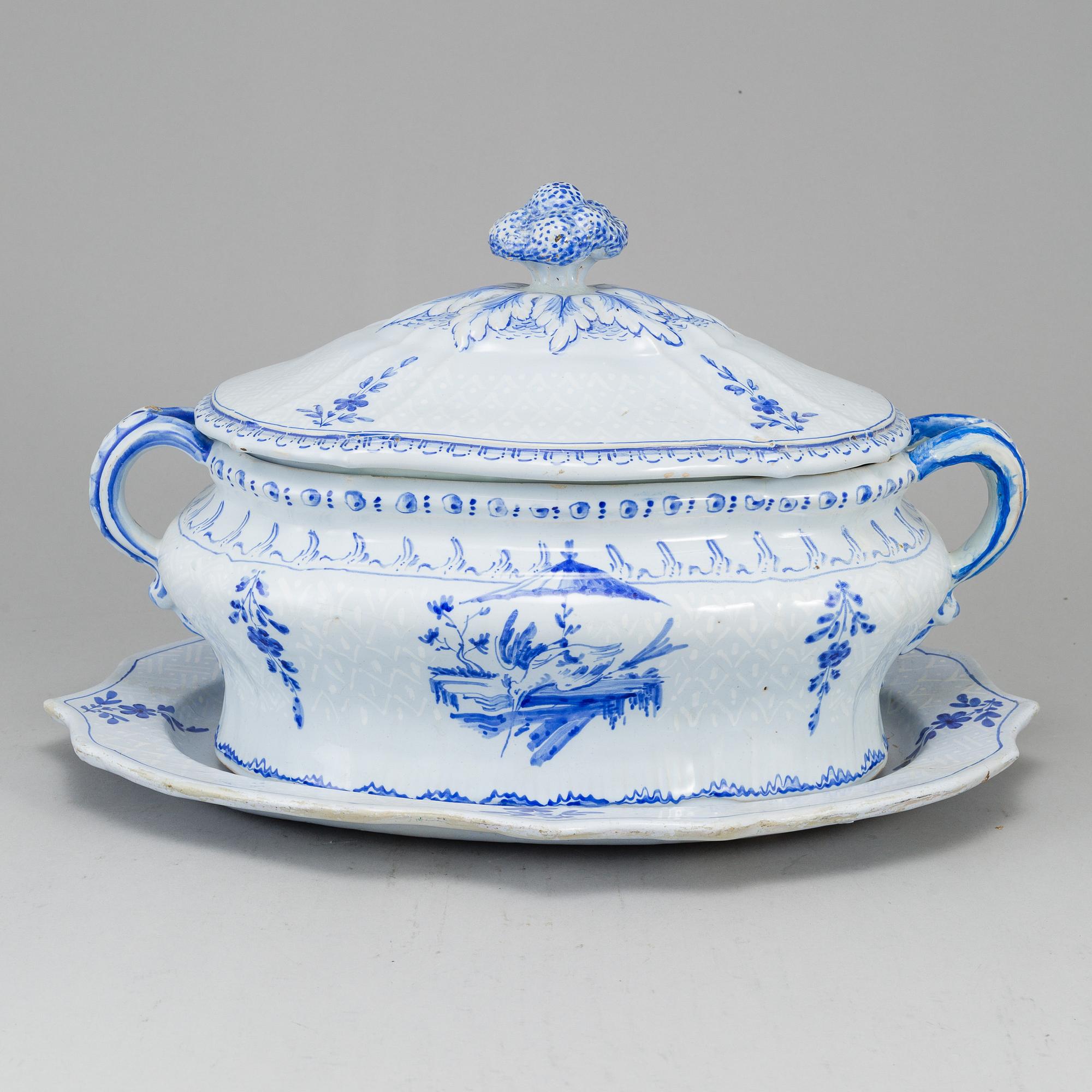A Swedish Rörstrand faience tureen with cover and stand, 18th Century.