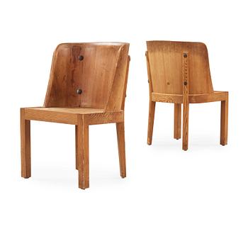 A pair of Axel Einar Hjorth 'Lovö' stained pine armchairs, Nordiska Kompaniet, Sweden 1930's.