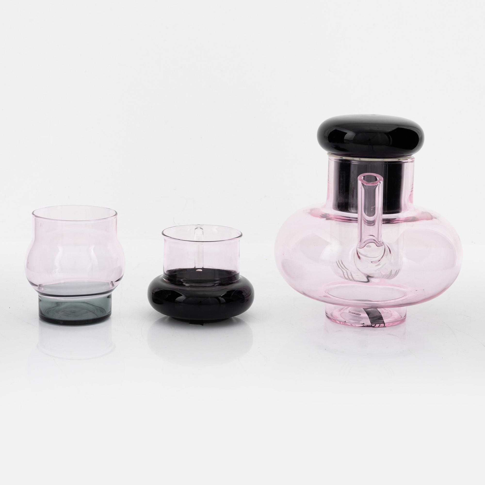Tom Dixon, A 'Bump' glass teapot with for cups and a pair of glasses.