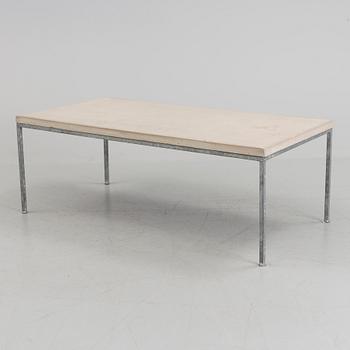 A modern sofa table with concrete top and steel legs.