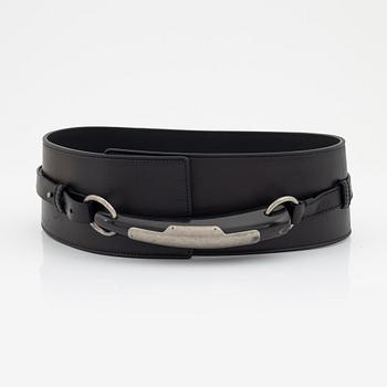 Yves Saint Laurent, a black leather and buckle belt, size 70.