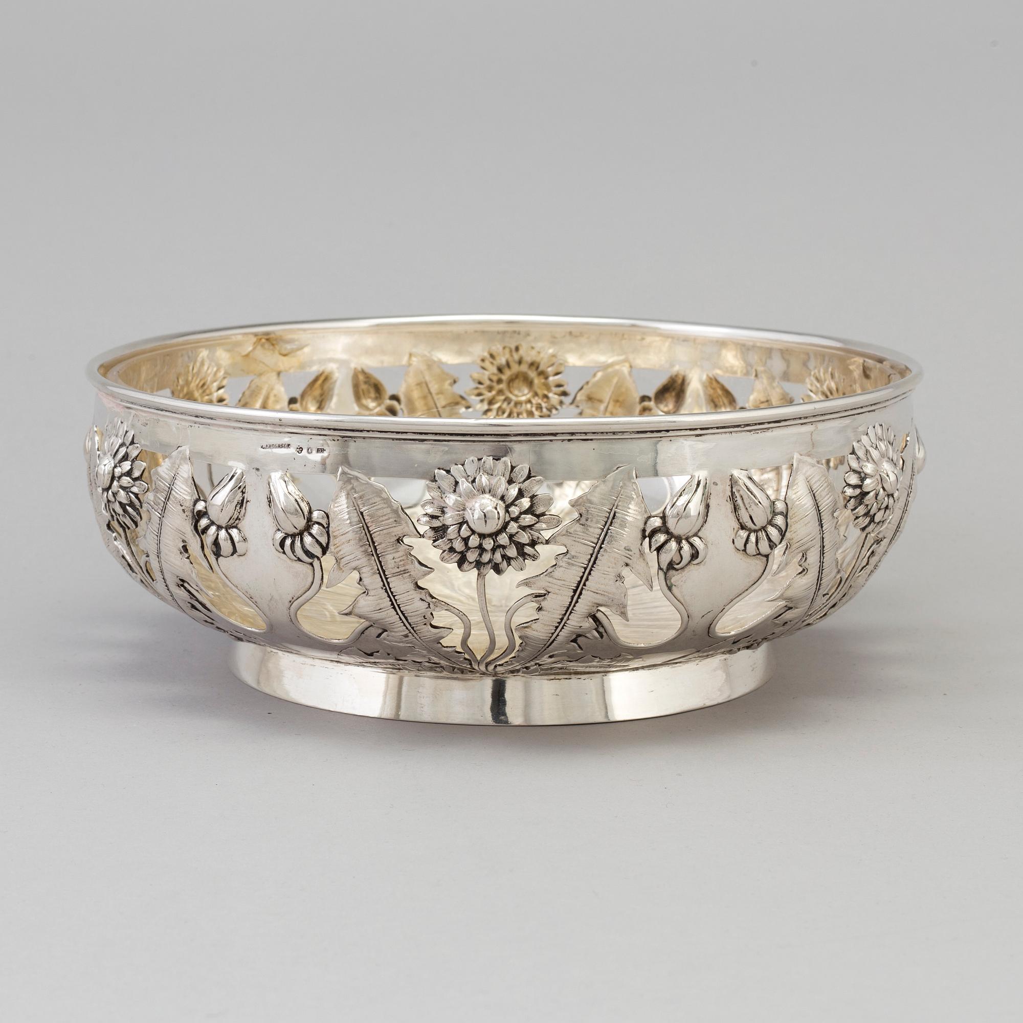 A Swedish Art Nouveau silver bowl with glass insert, decorated with dandelion, maker's mark K Anderson Stockholm 1906.