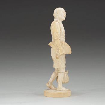 A Japanese ivory figure of a fisherman, Meiji (1868-1912).