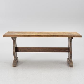 A solid pine dining table, 20th century.