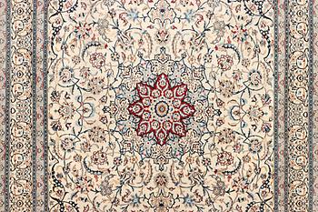 A Nain carpet, part silk, 9 laa, c. 390 x 295 cm.