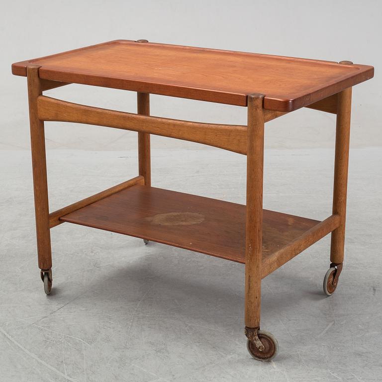 Hans J Wegner, a teak and oak serving trolley from Andreas Tuck, Denmark.