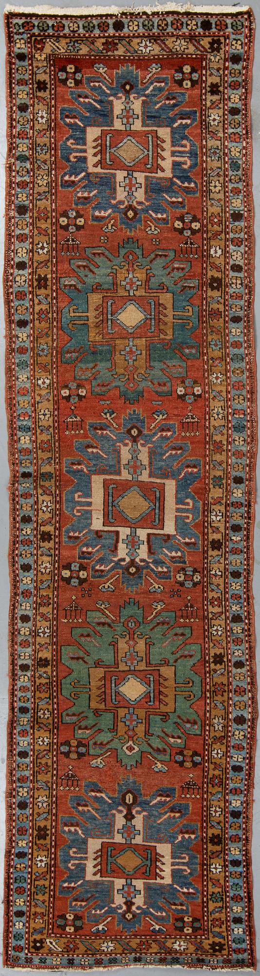 A Heriz runner, ca 310 x 85 cm.