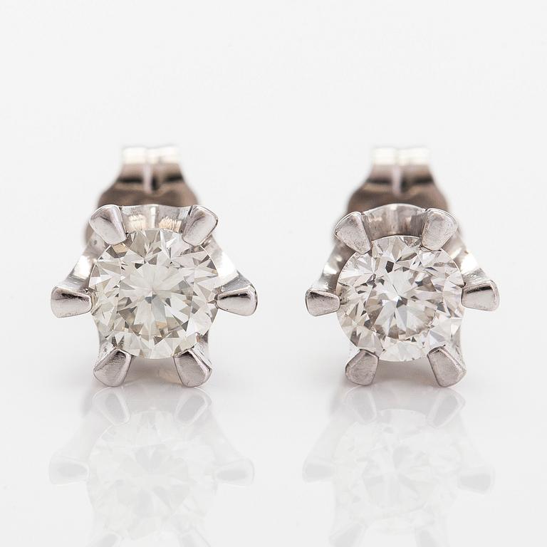 A pair of 14K white gold, earrings 
 with brilliant-cut diamonds totalling approximately 0.74 ct.