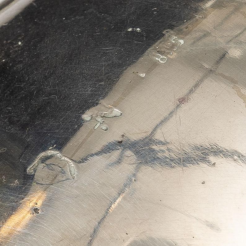 A Rococo style silver sauce boat with dish, 20th Century.