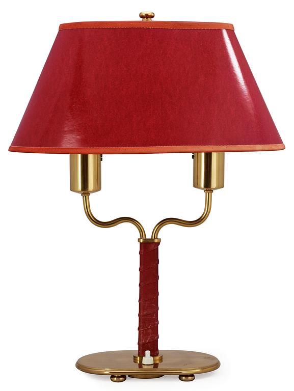 A Josef Frank brass and red leather table lamp by Svenskt Tenn.