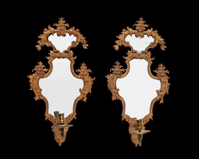 A pair of late Baroque early 18th century girandole mirrors.
