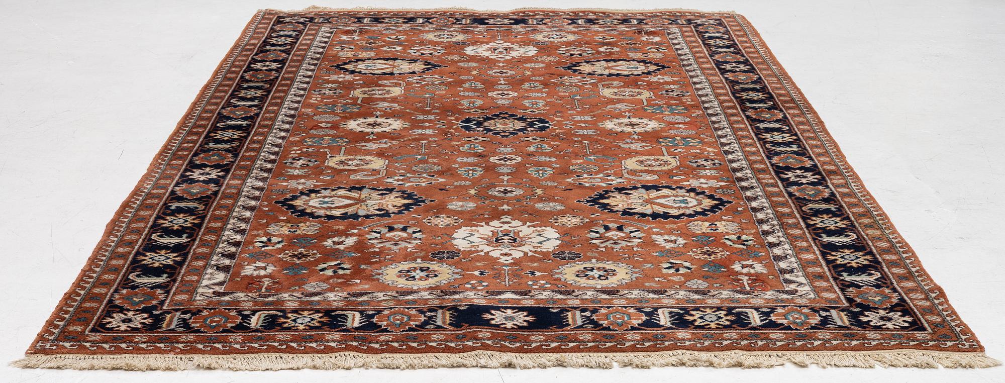 A semi-antique Orientall carpet c. 318 x 202 cm.