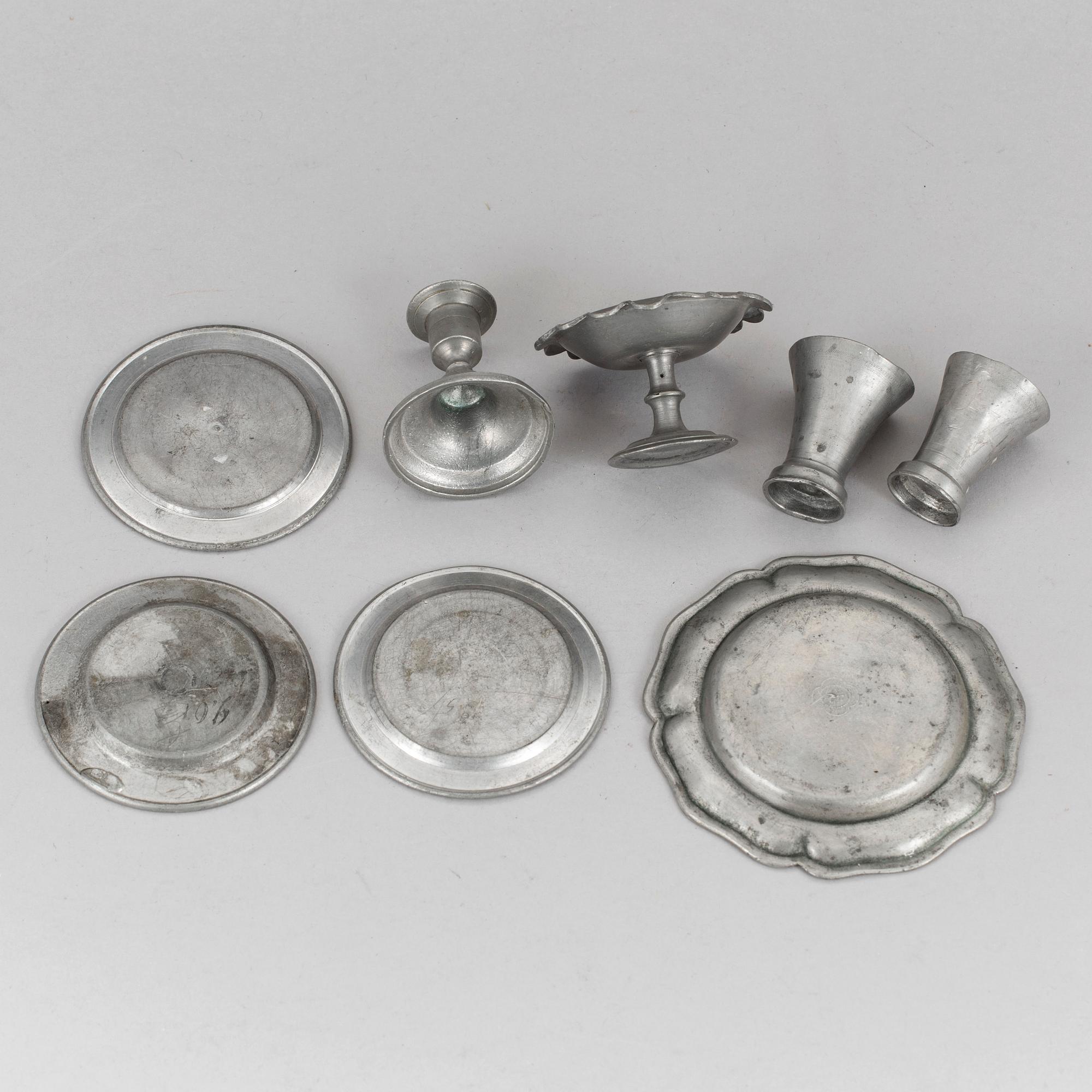 A lot of eight pewter doll house accessories 19th century.