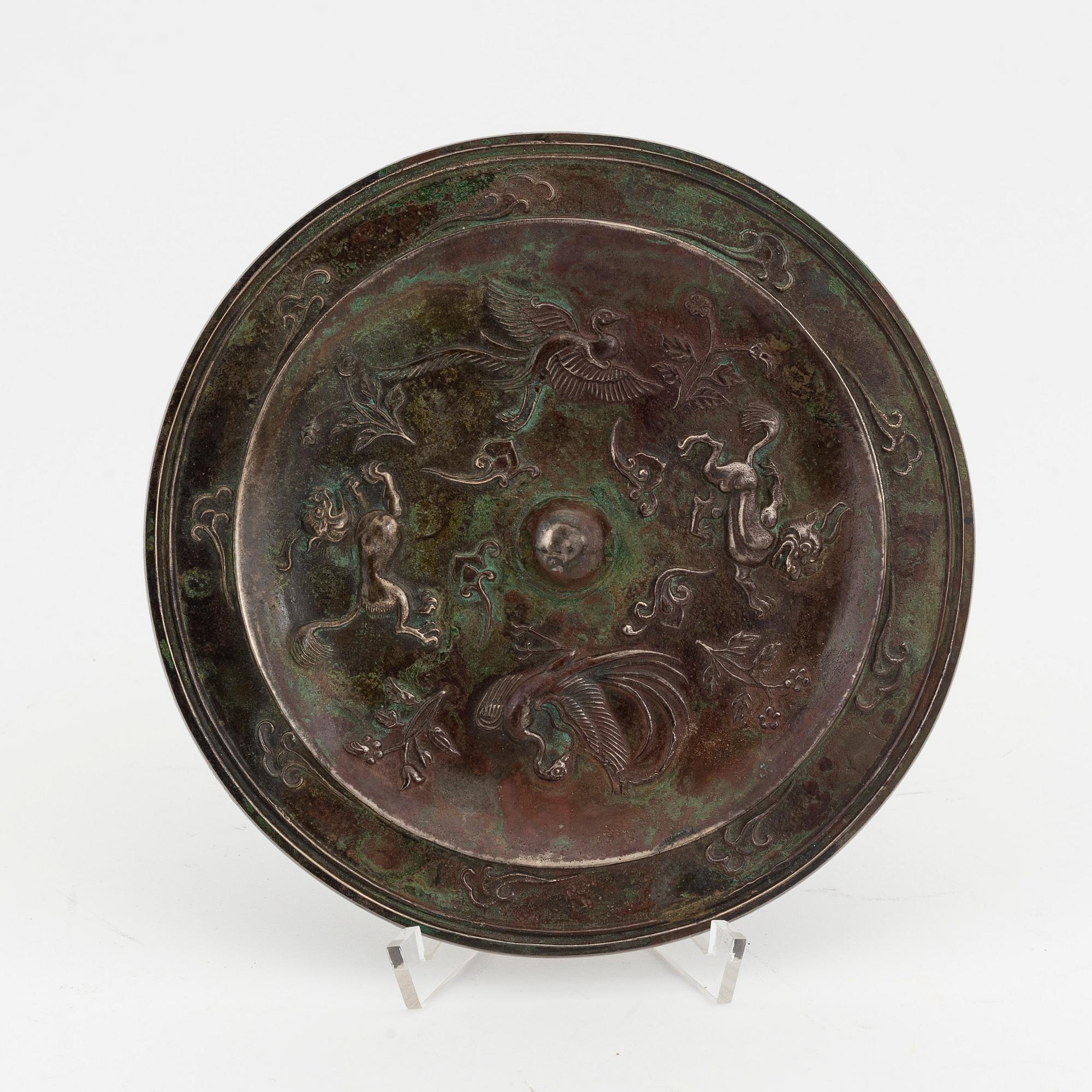 A Chinese bronze mirror, presumably Ming dynasty (1368-1644).