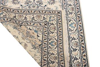 A Nain part silk rug, c. 193 x 148 cm.
