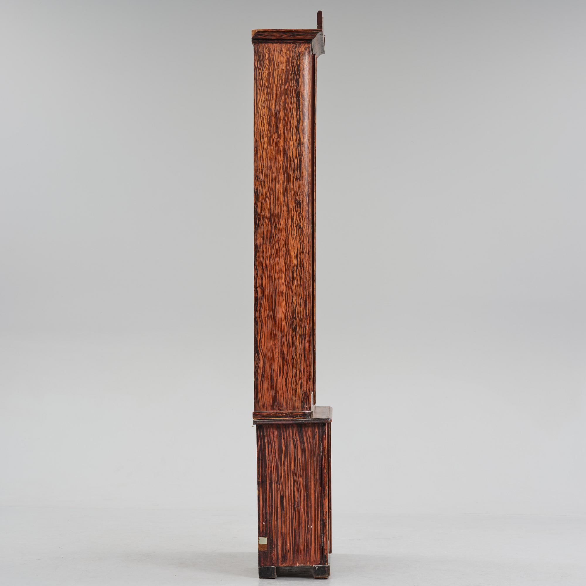 A Swedish faux-boix neo-gothic book cabinet, ca 1830.