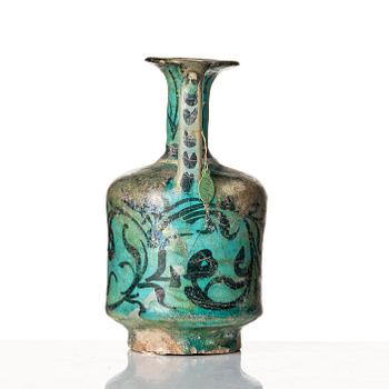 A Kashan turquoise blue-glazed ewer, central Persia (Iran), 11th to 12th century.