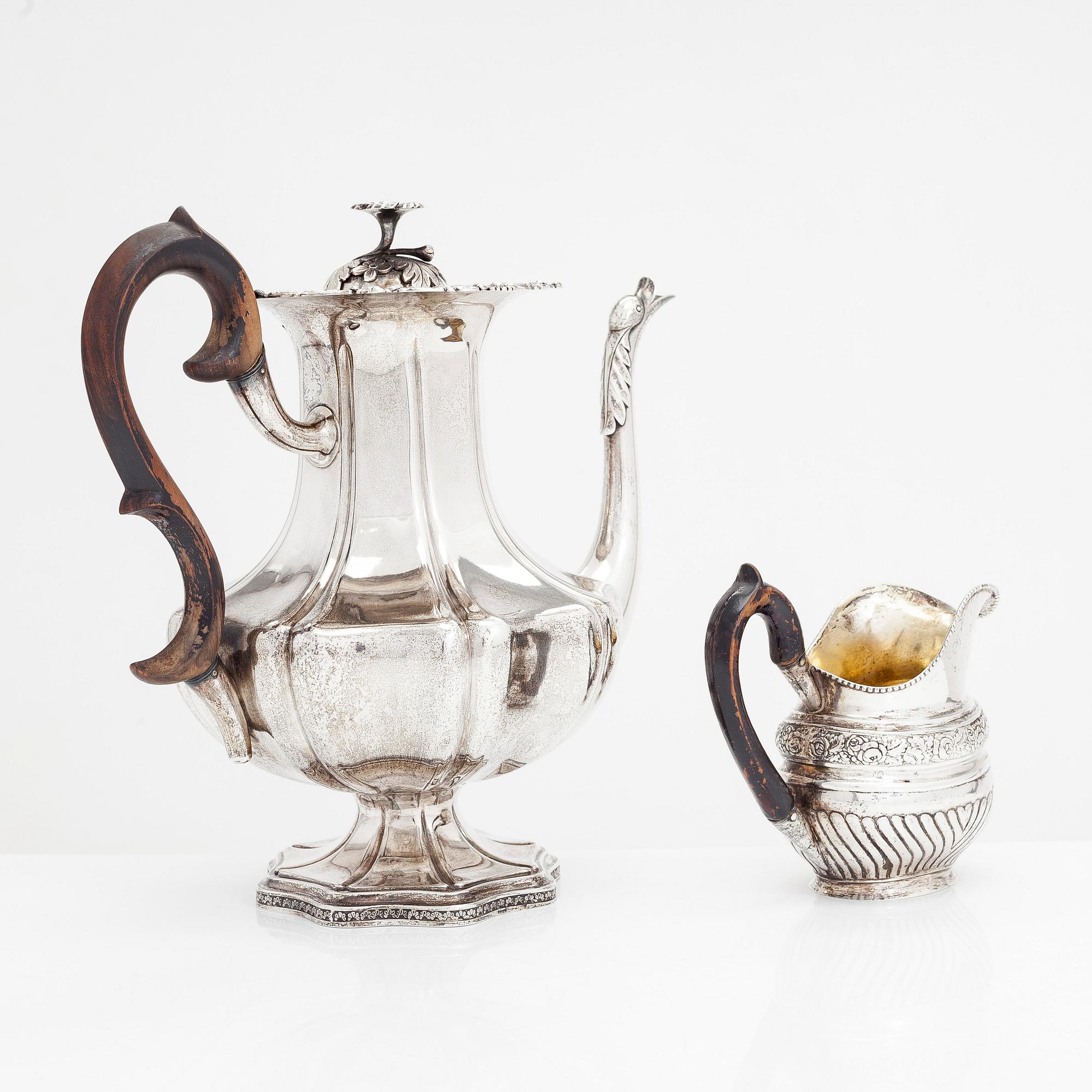 A silver coffee pot, and silver cream jug, Olof Robert Lundgren, Turku 1847 and Fredrik Strömsten, Helsinki 1839.