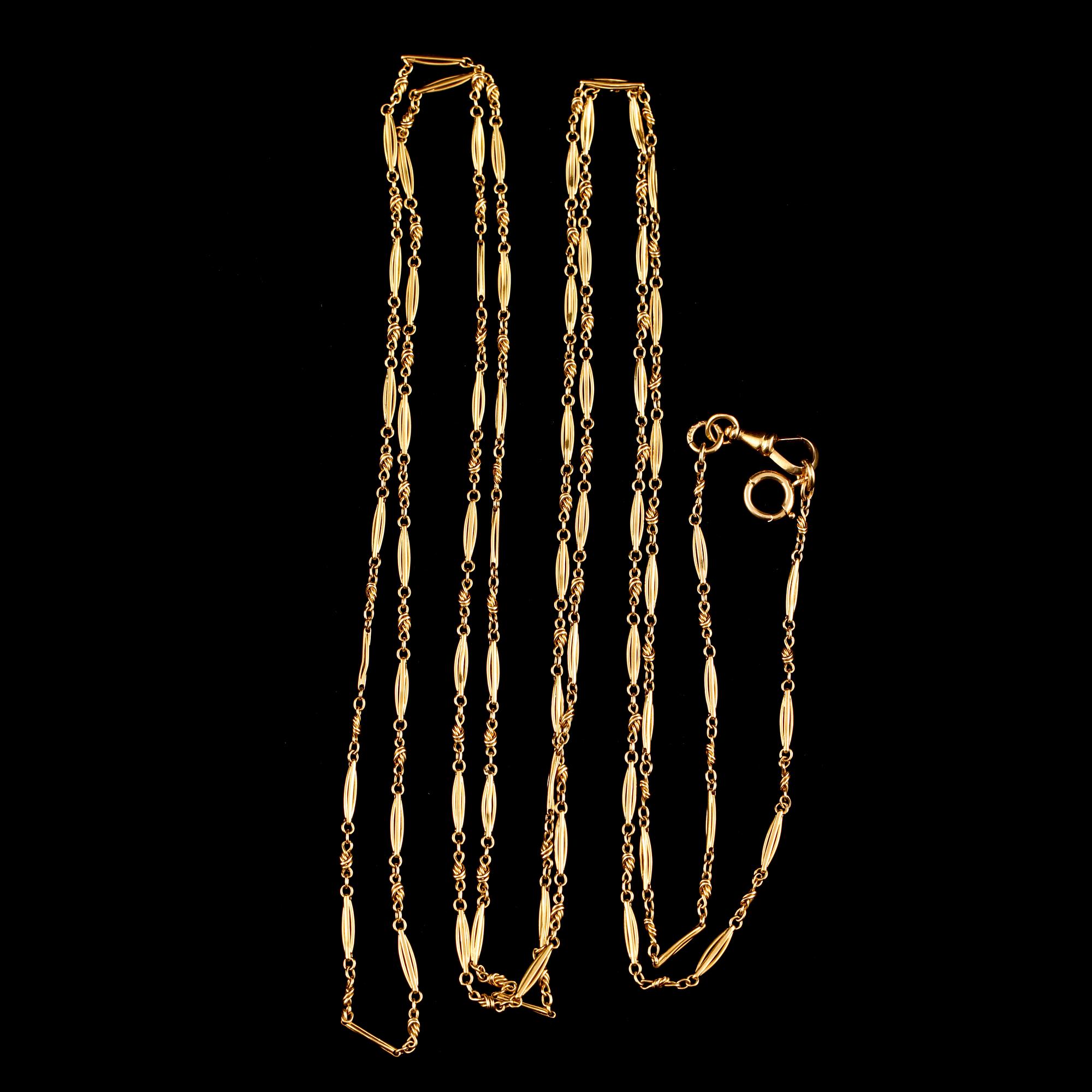 KLOCKKEDJA, 18k guld, kattfotstämplad, 1900-talets första hälft. Vikt 29 g.
