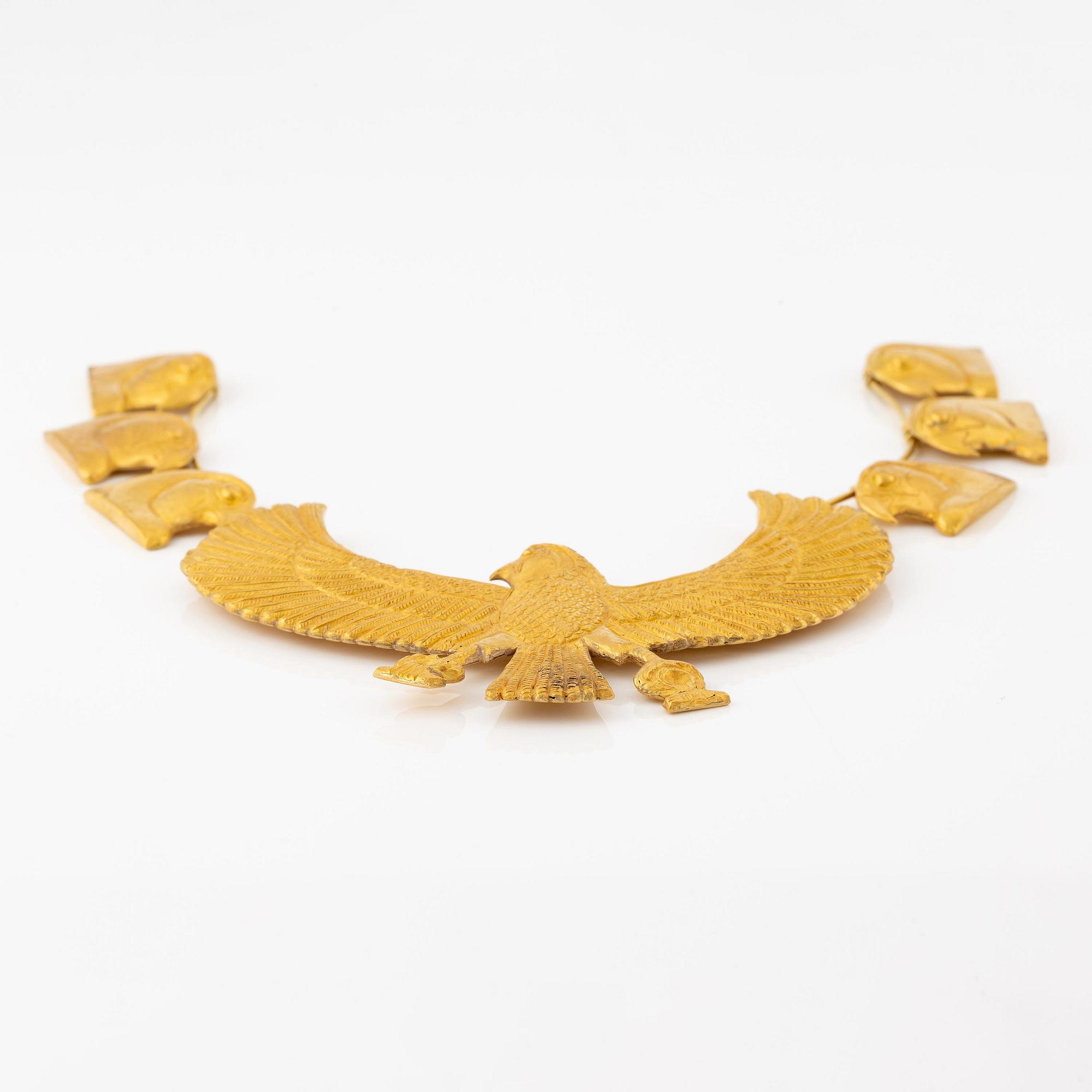 A modern Egyptian-style gold necklace.