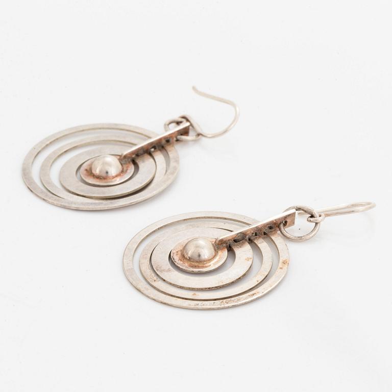 A pair of silver Tapio Wirkkala earrings.