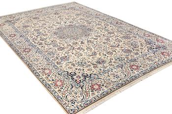 A Nain, part silk carpet, c. 474 x 322 cm.