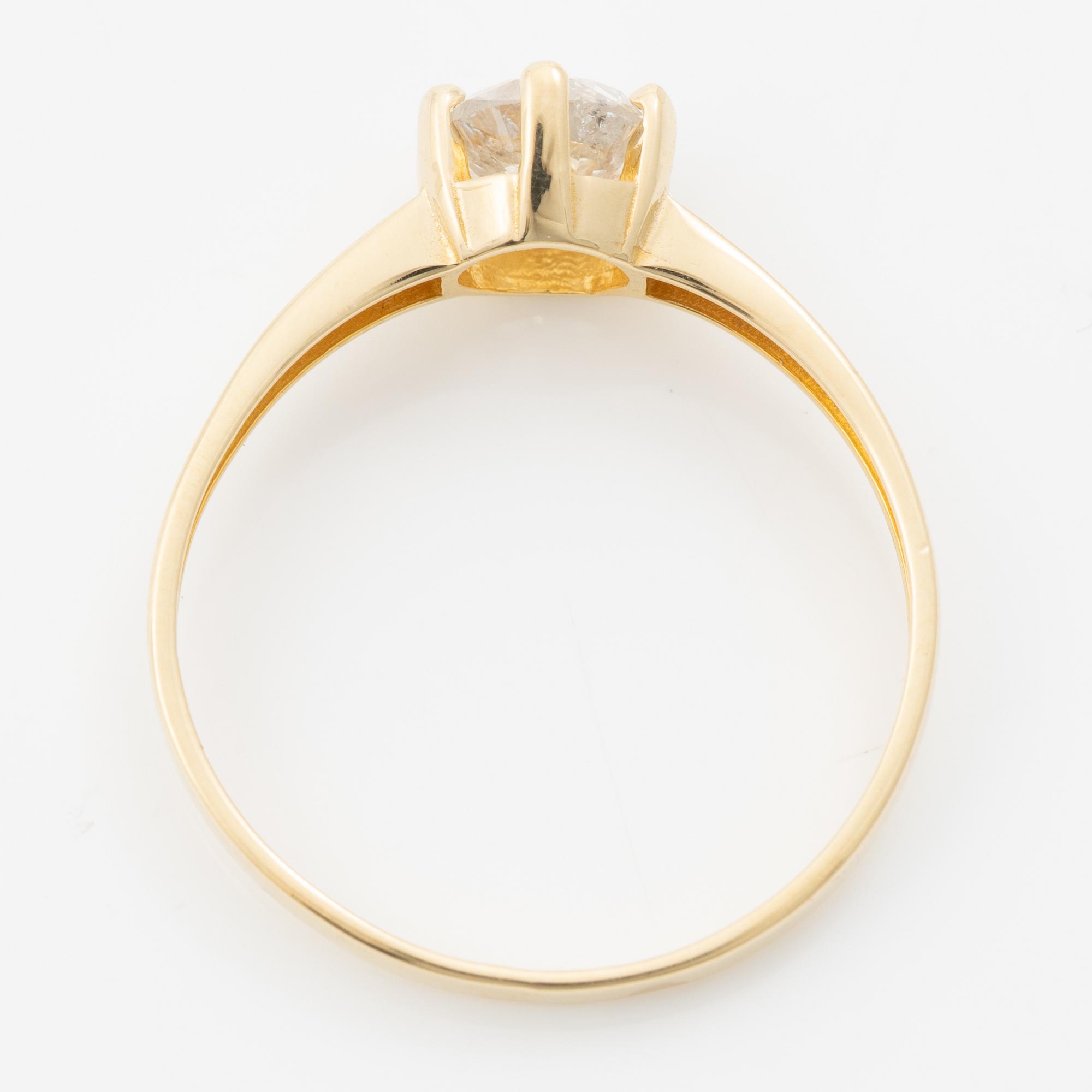 18K gold ring with an old-cut diamond.