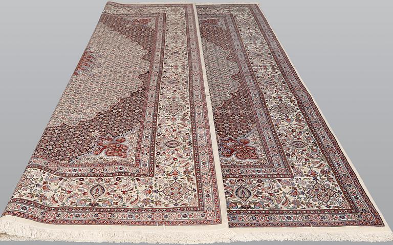 A part silk Moud carpet, approximately 350 x 252 cm.