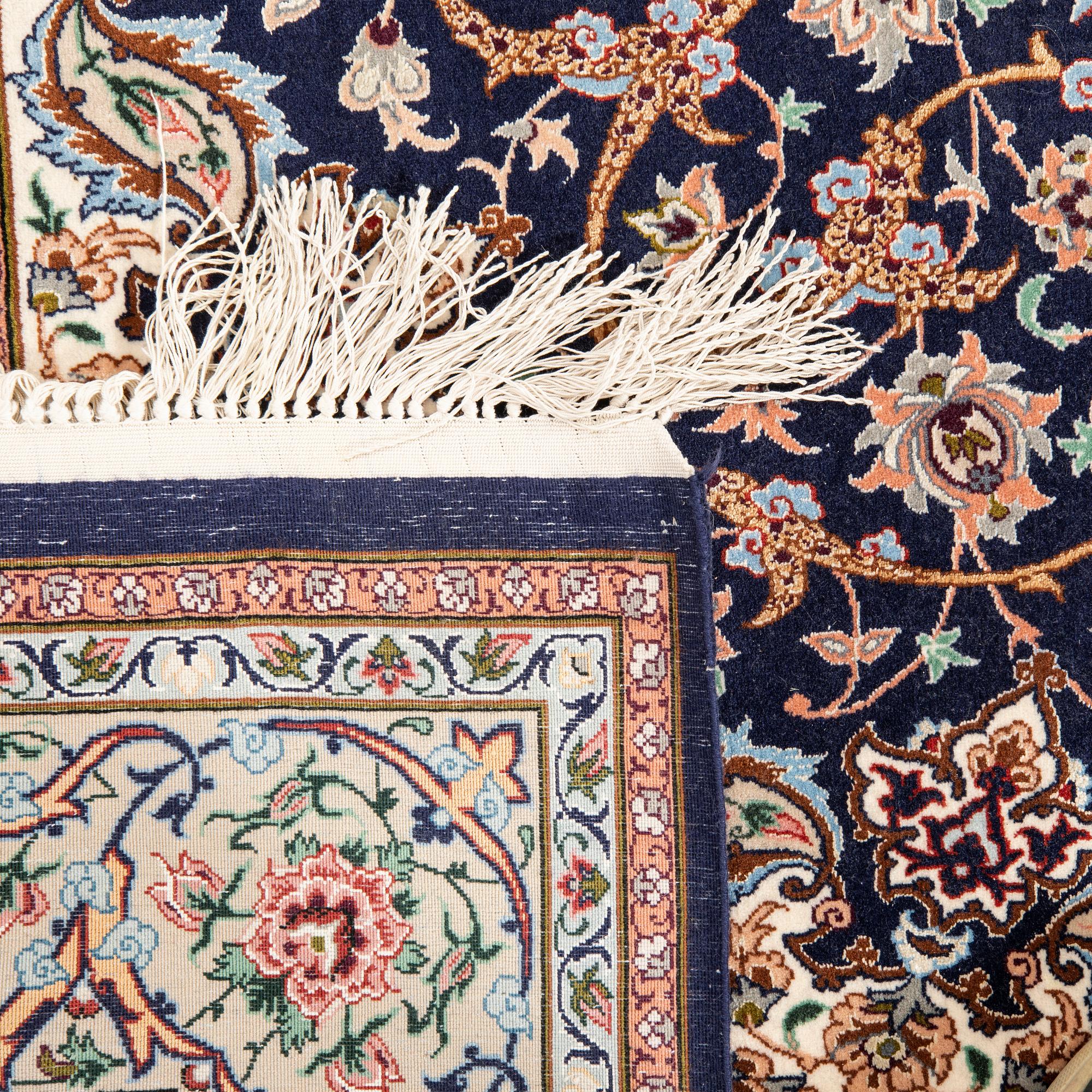 An old isfahan carpet signed part silk approx 223x146 cm.
