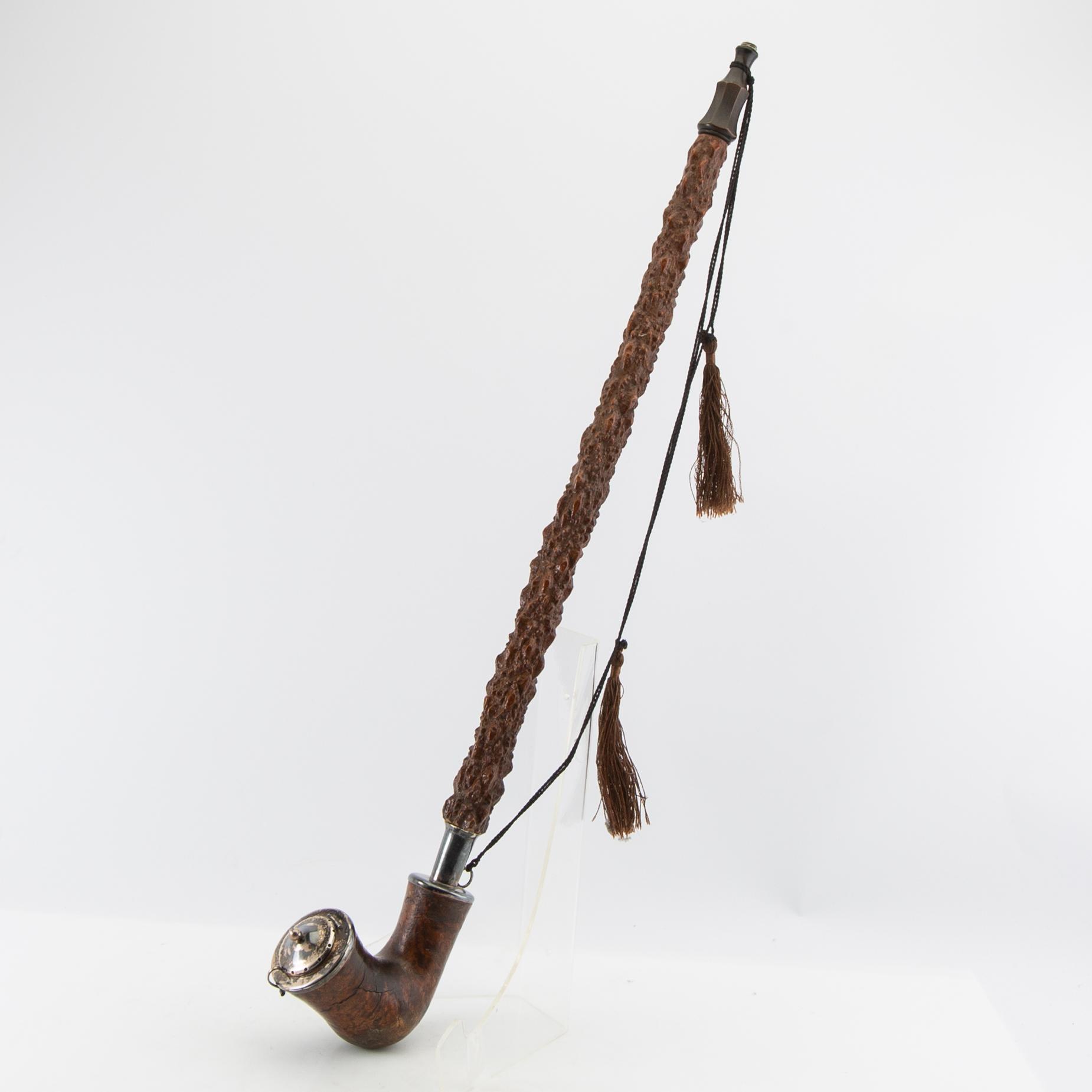 Long pipe  Carved wood with a silver mount Hasa Malmö 1986.