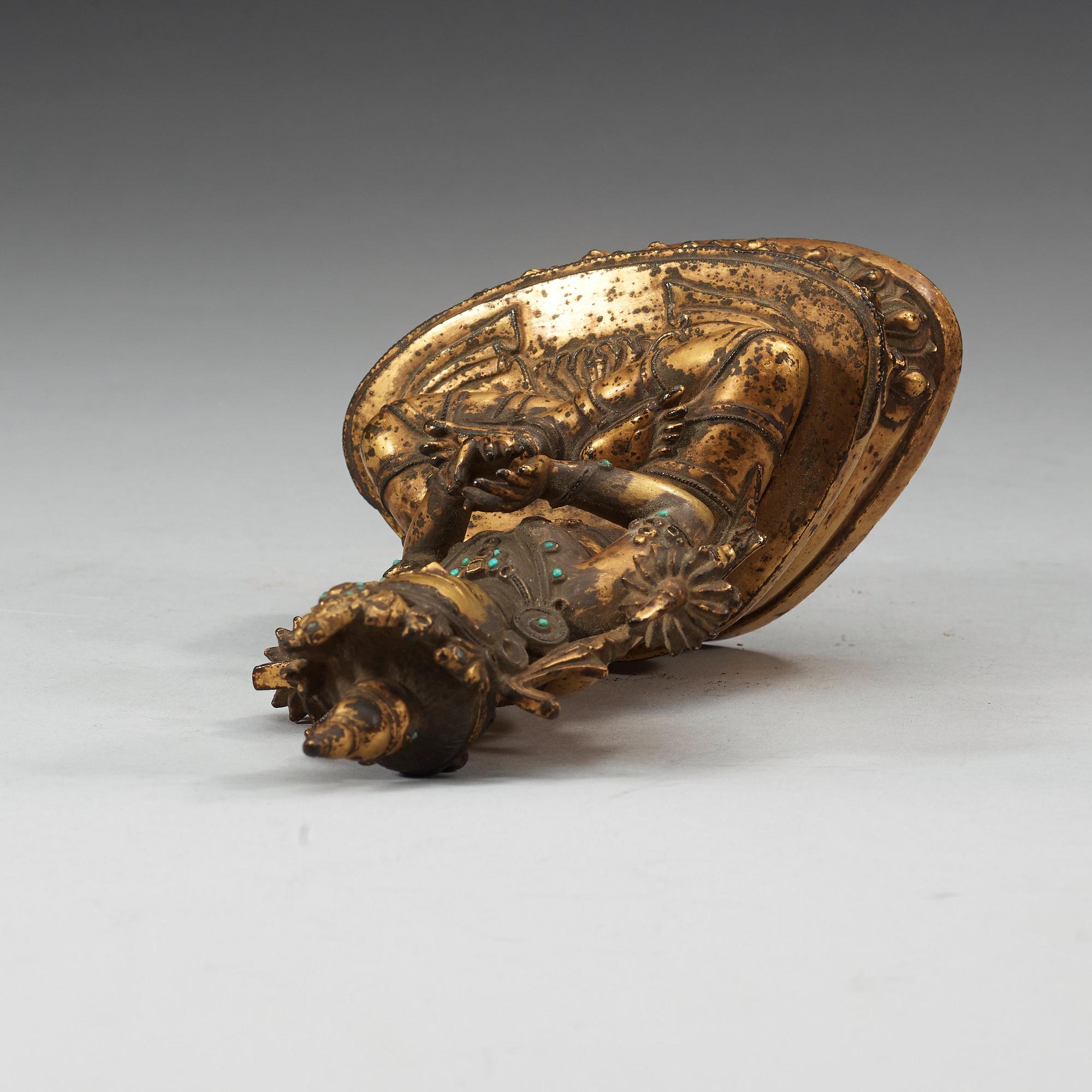 A gilt copper alloy figure of Manjushri, Nepal 15th/16th Century.