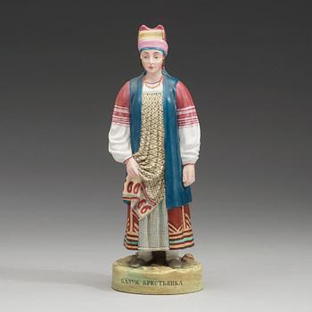 A Russian biscuit figure of a peasant woman from Kaluga, Gardner, Verbilki, Dmitrov gub, (1891-1917).