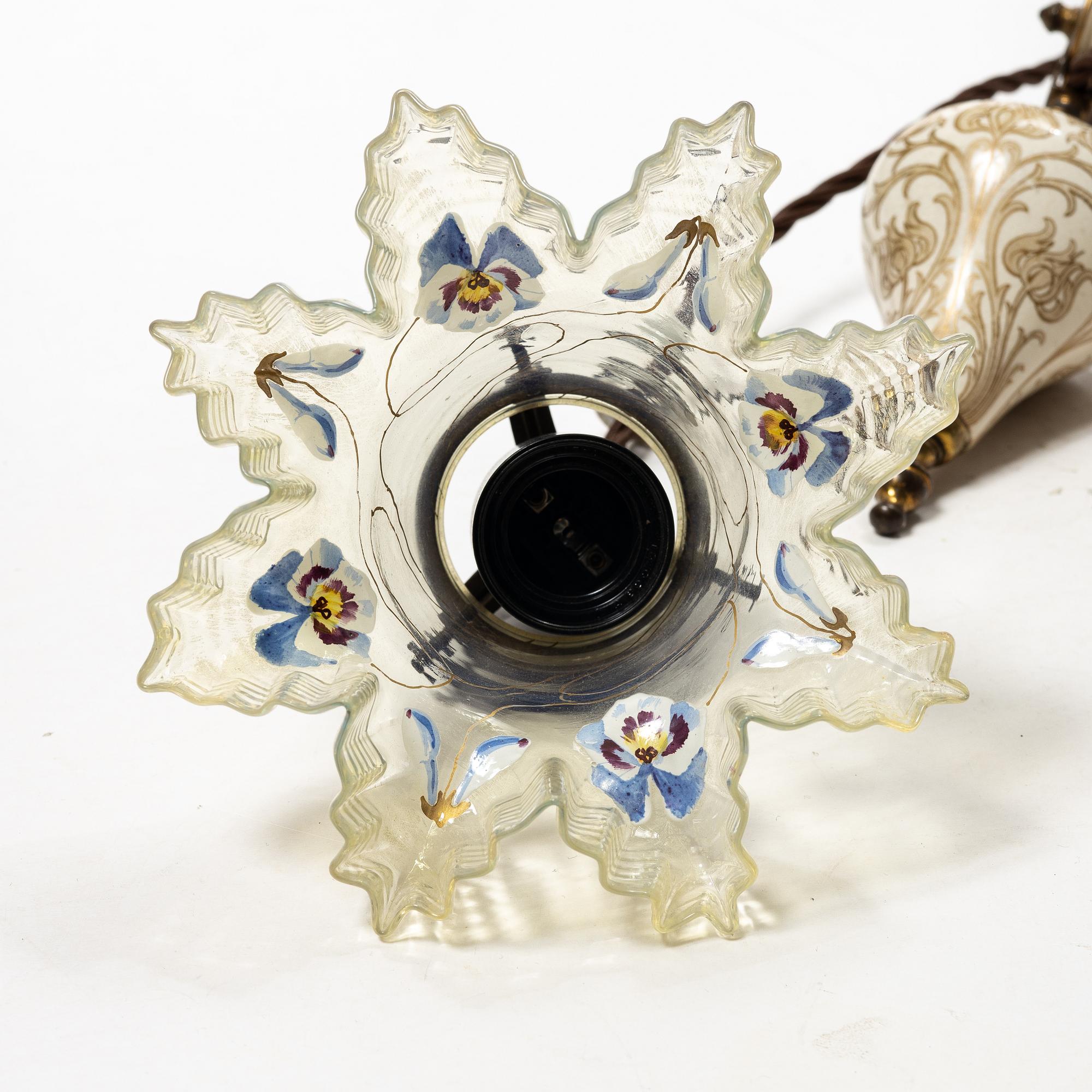 A glass and creamware lamp, possibly France, Art Nouveau.