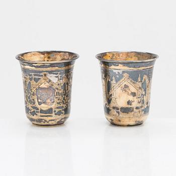 Four parcel-gilt silver beakers, Moscow 1870, 1876 and 1890.